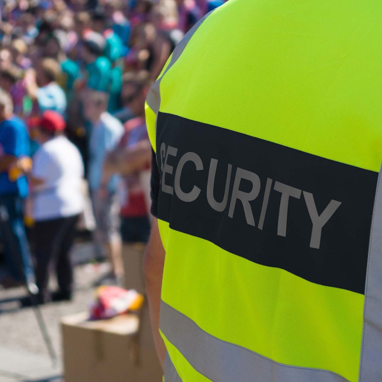 A security officer at the concert. A security officer at work to ensure order at the concert.
